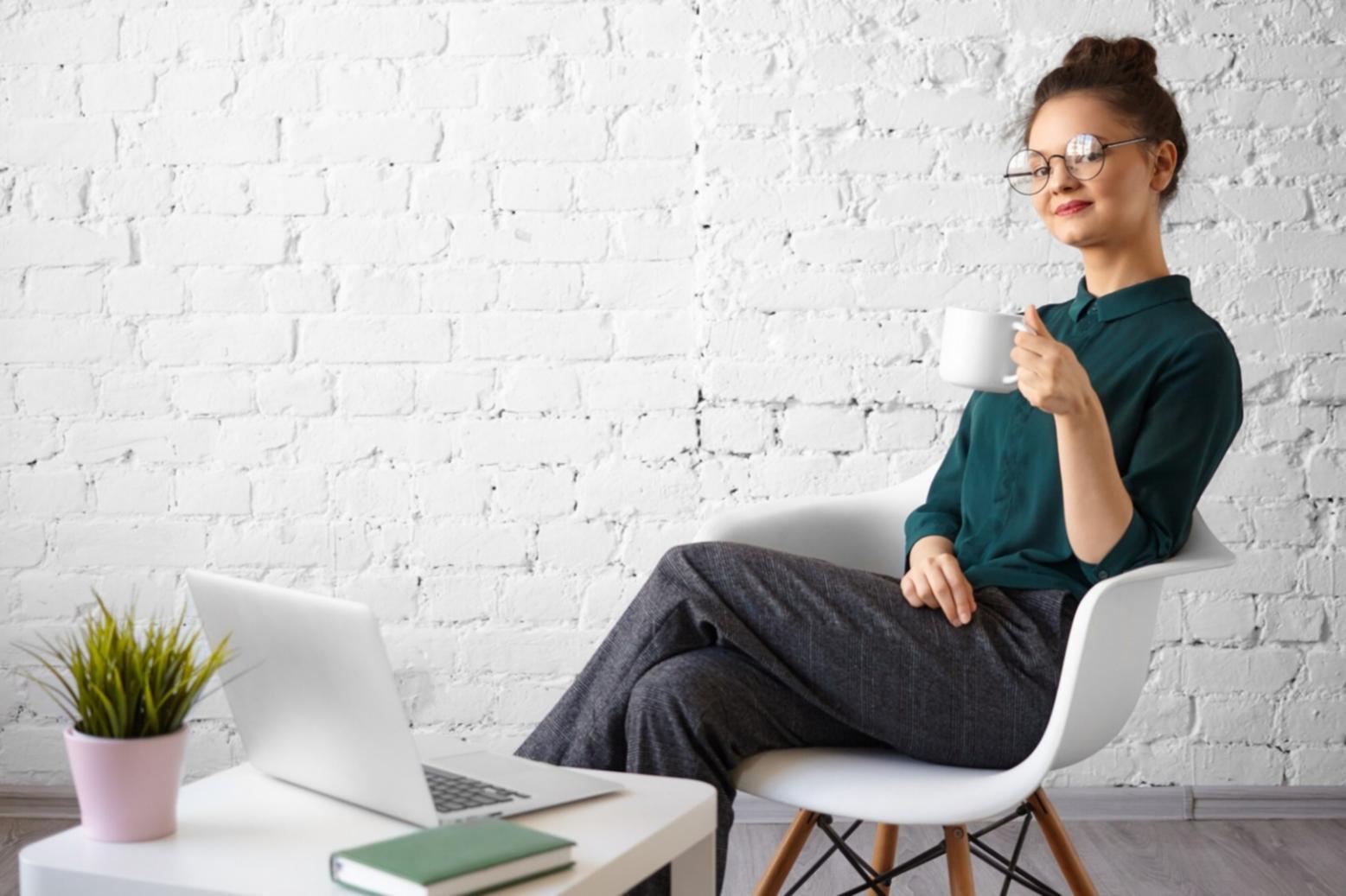 Small business owner reviewing budget documents at desk